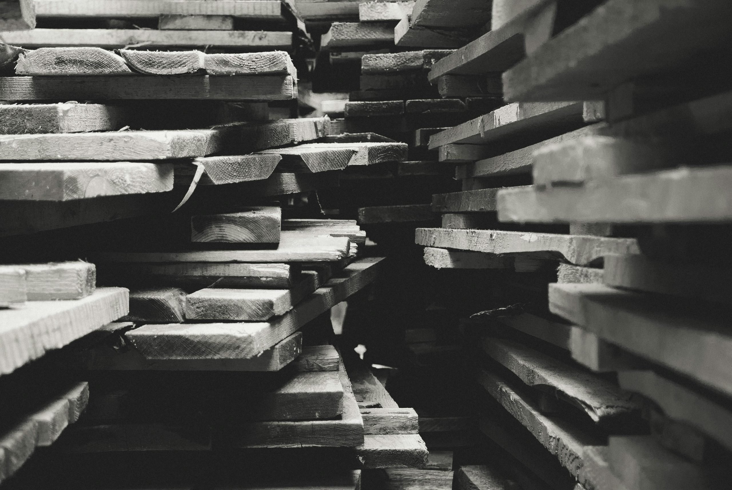 Close-up of stacked lumber boards showing wood grain and texture